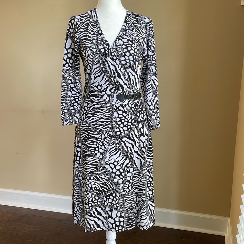 Mesmerize Wrap Dress in black/white pattern. Faux wrap. Side zip. Fitted. Size S